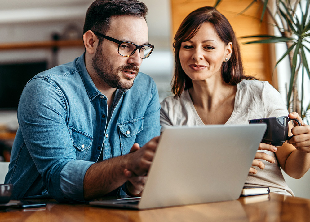 Couple Looking at Laptop Computer Together