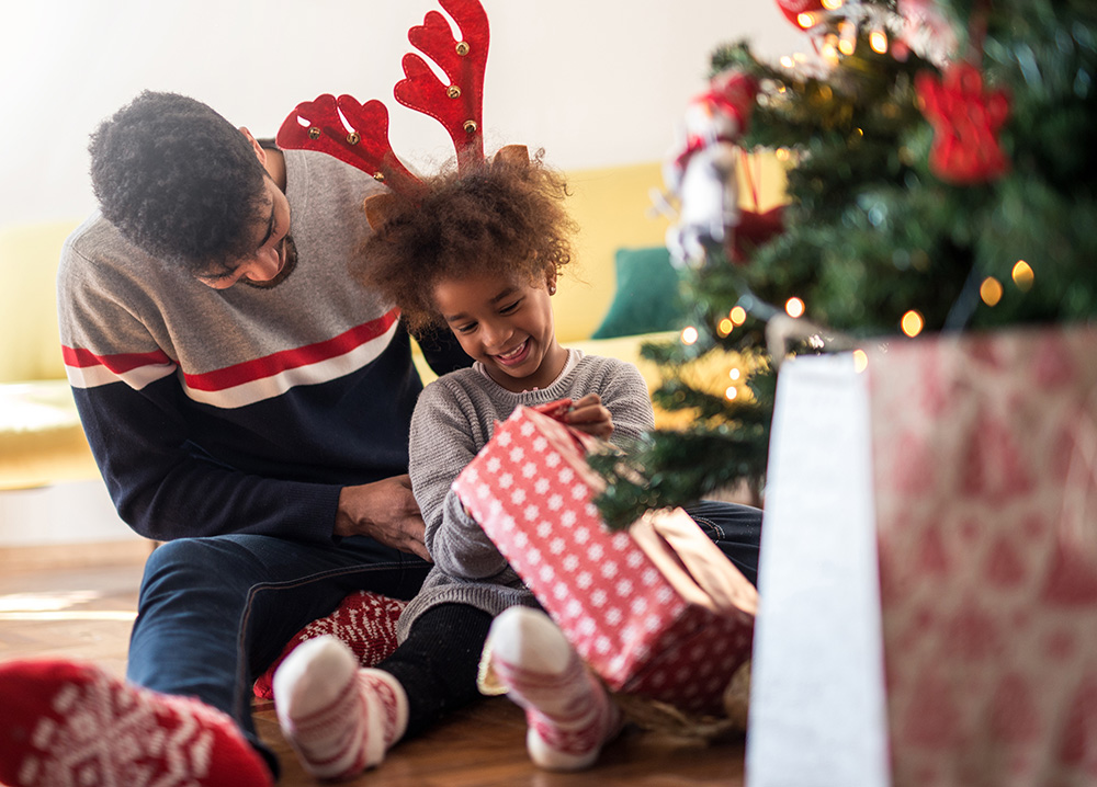 Little Girl Opening Christmas Gifts