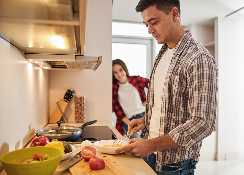 Young Couple Cooking in Small Kitchen