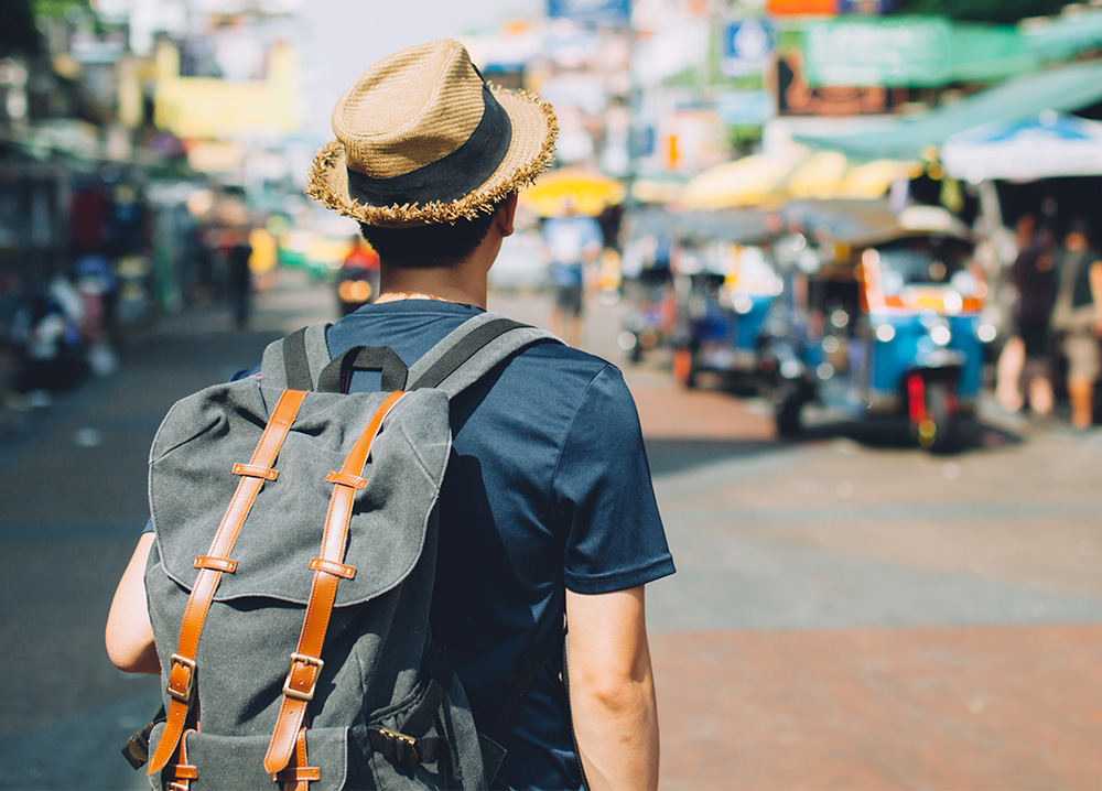 Young Man Traveling with Backpack